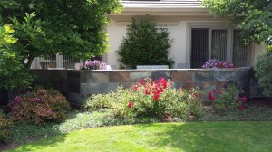 This wall is actually made of porcelain that looks like slate. it achieves a similar look but will withstand the elements of the outdoors without eroding.